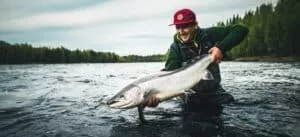 Kengis Bruk lodge manager Aslak Lund with a Torne river Baltic salmon