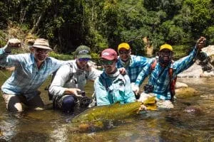 golden dorado and fishermen